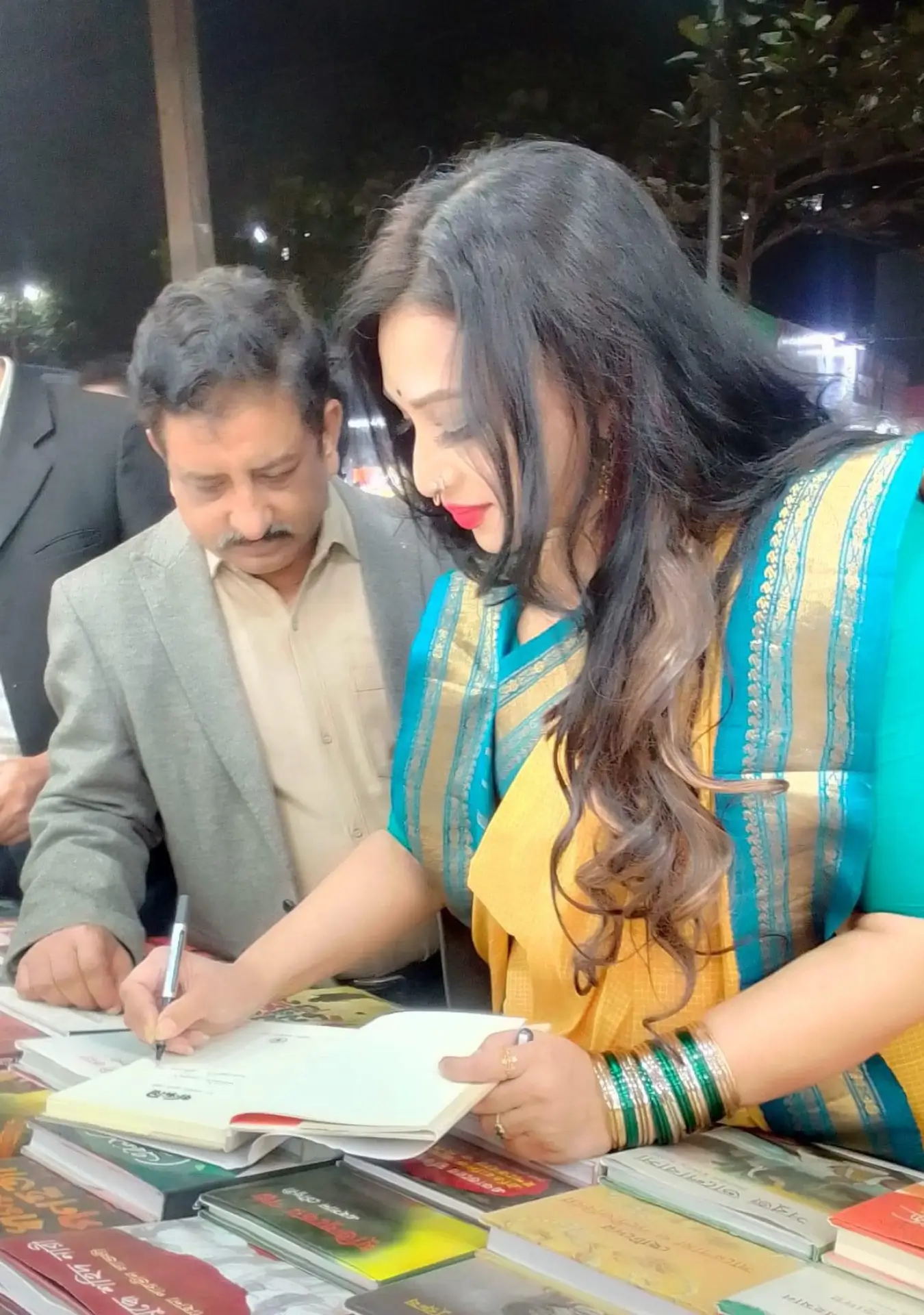 Dr Sabrina giving autograph on her book Bondini at Ekushy Boimela
